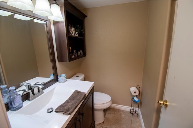 1284 William Mcgrath St, Colton, CA 92324 - half bathroom with toilet, vanity, tile patterned flooring, and baseboards