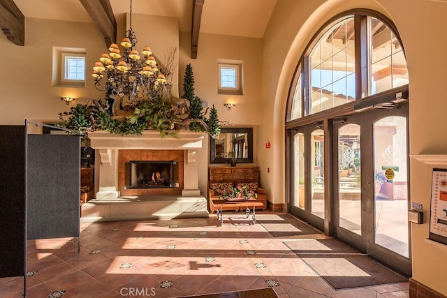interior space featuring french doors and an inviting chandelier