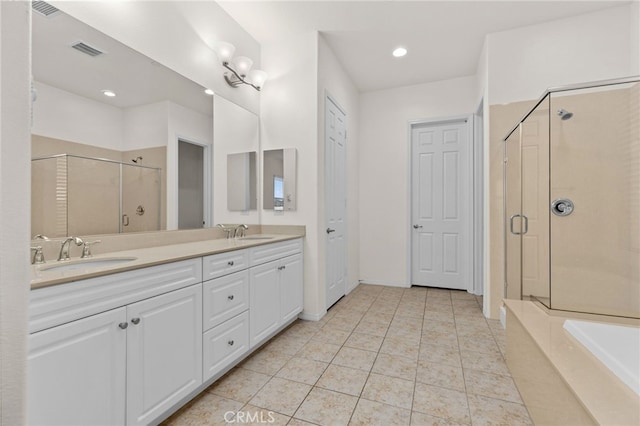 full bathroom with double vanity, visible vents, a sink, and a stall shower