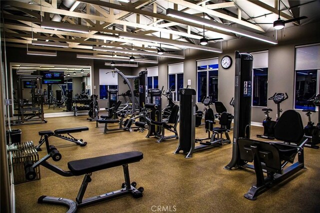 gym featuring vaulted ceiling