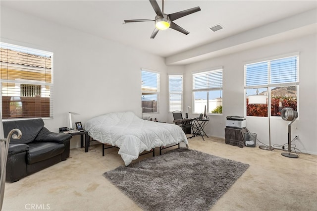 bedroom featuring carpet floors, baseboards, a ceiling fan, and visible vents