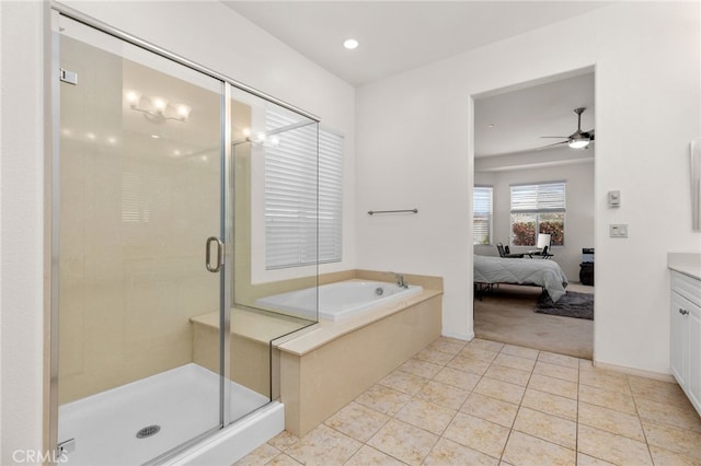 ensuite bathroom featuring tile patterned floors, vanity, ensuite bathroom, and a stall shower