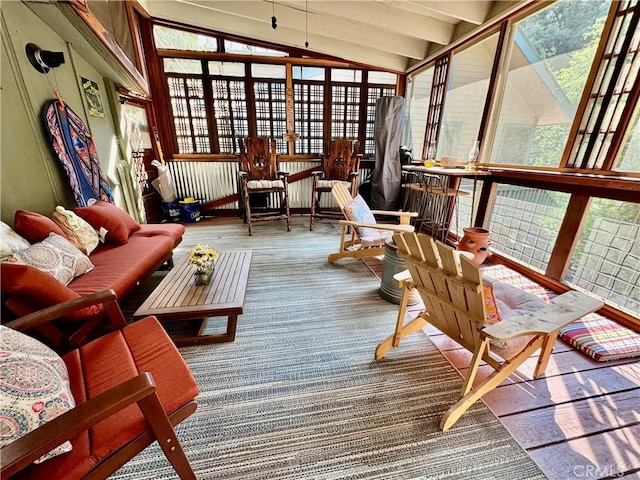 sunroom featuring vaulted ceiling