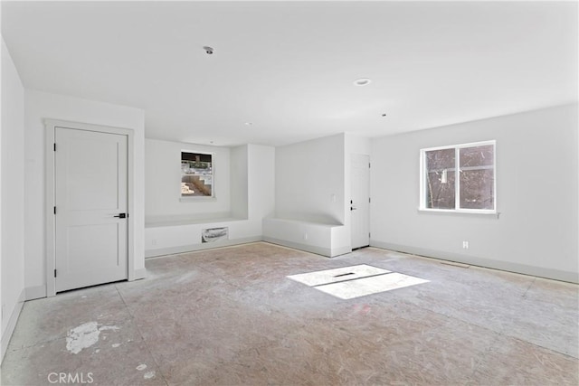 empty room with baseboards