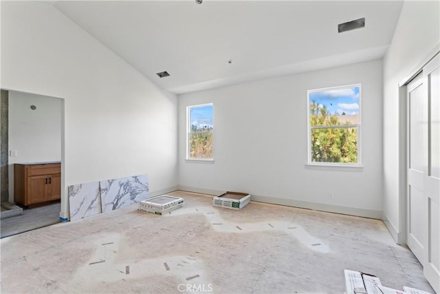 26701 Merced Ln, Lake Arrowhead, CA 92352 - unfurnished bedroom with vaulted ceiling and baseboards