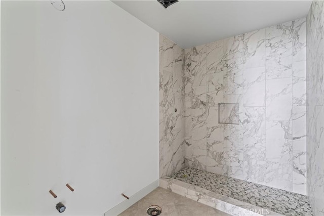 full bath featuring a marble finish shower and visible vents