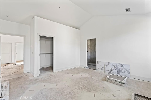 unfurnished bedroom featuring lofted ceiling
