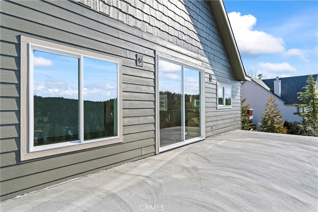 view of side of property with a patio