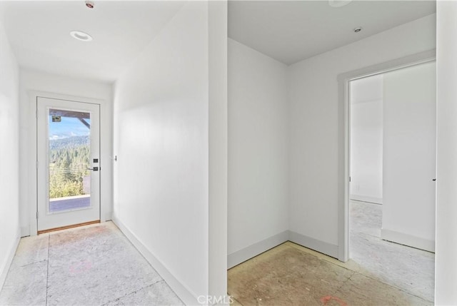 corridor featuring baseboards