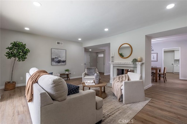 9128 Gerald Ave, Northridge, CA 91343 - living room with wood finished floors, recessed lighting, baseboards, and a premium fireplace