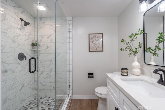 9128 Gerald Ave, Northridge, CA 91343 - full bath featuring a shower stall, wood finished floors, toilet, vanity, and baseboards