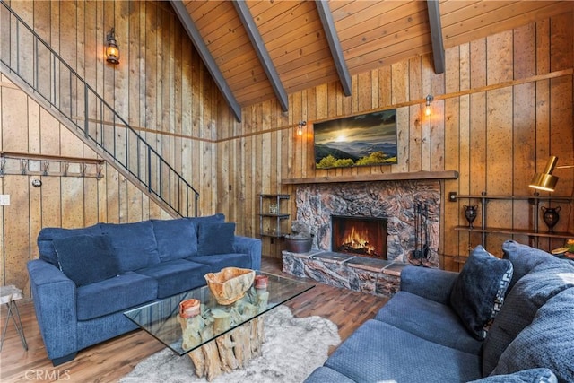 26375 Augusta Dr, Lake Arrowhead, CA 92352 - living area with wood walls, vaulted ceiling with beams, and wood finished floors