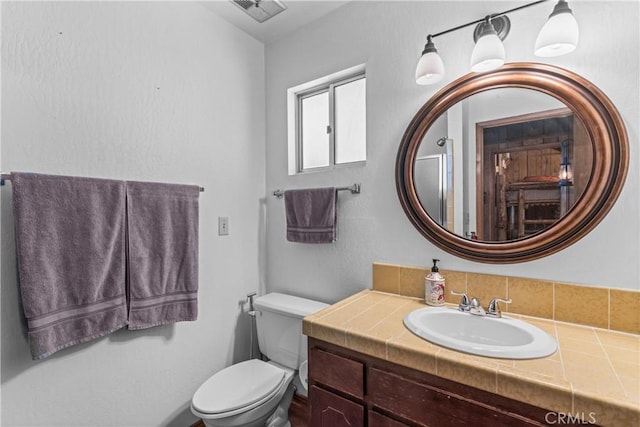 26375 Augusta Dr, Lake Arrowhead, CA 92352 - bathroom with toilet, vanity, and visible vents
