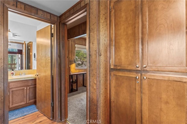 26375 Augusta Dr, Lake Arrowhead, CA 92352 - hall featuring a sink, light wood-style flooring, and a healthy amount of sunlight