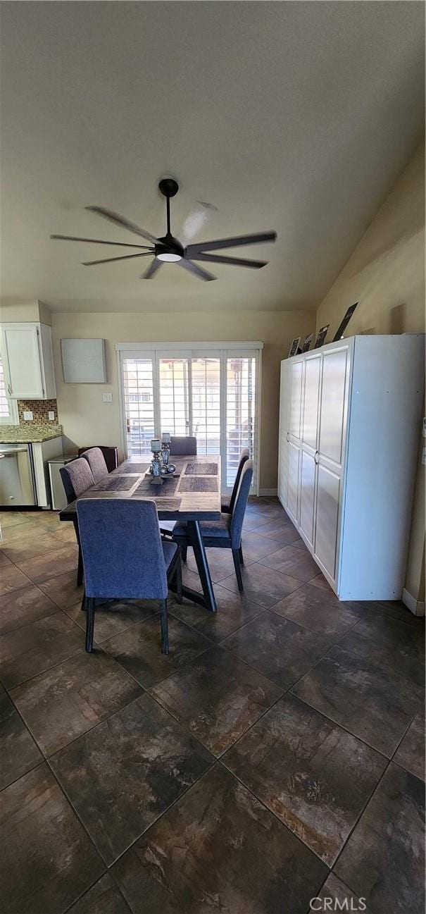 dining room with baseboards and ceiling fan