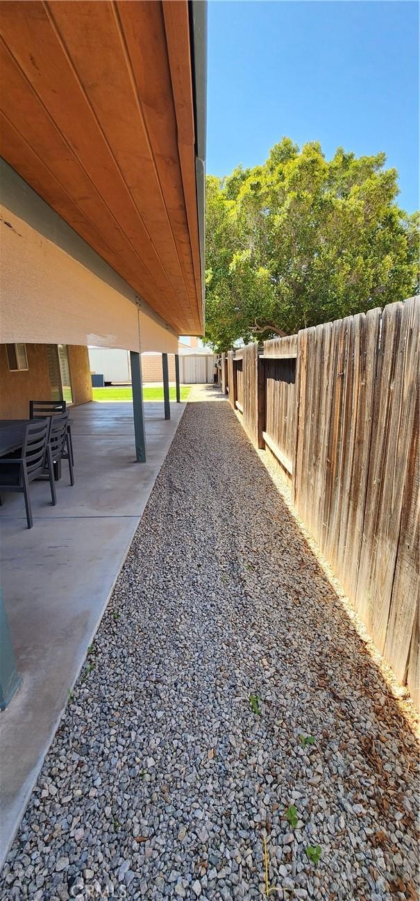 view of yard with a patio and a fenced backyard