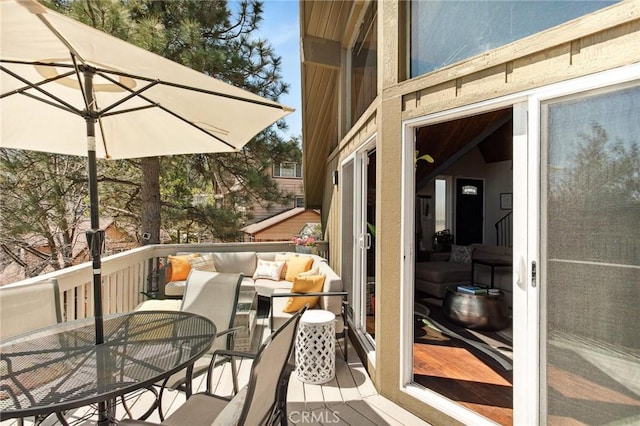 27482 Matterhorn Dr, Lake Arrowhead, CA 92352 - wooden deck with outdoor dining area and an outdoor hangout area