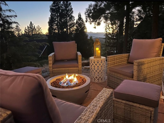 27482 Matterhorn Dr, Lake Arrowhead, CA 92352 - patio terrace at dusk featuring an outdoor fire pit and a patio