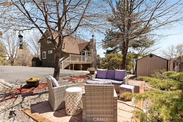27482 Matterhorn Dr, Lake Arrowhead, CA 92352 - view of patio with outdoor lounge area, a deck, and a shed
