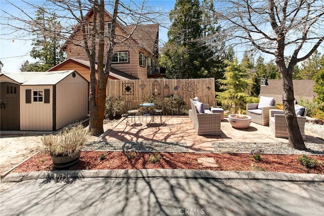 27482 Matterhorn Dr, Lake Arrowhead, CA 92352 - view of patio featuring a shed and an outdoor fire pit