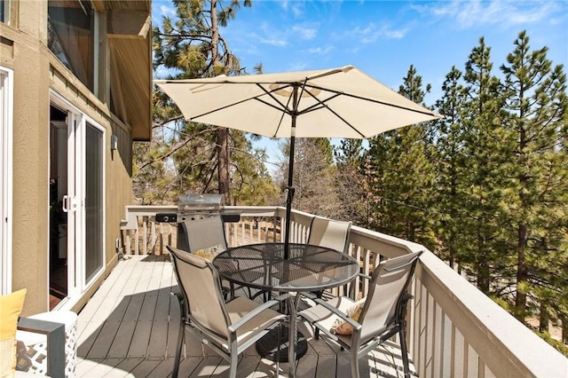27482 Matterhorn Dr, Lake Arrowhead, CA 92352 - wooden deck with outdoor dining space and area for grilling