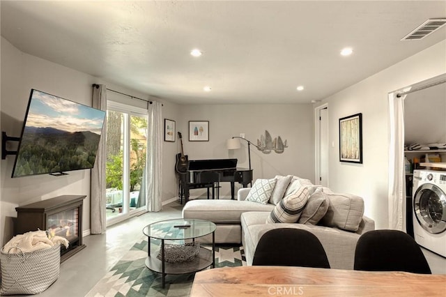 27482 Matterhorn Dr, Lake Arrowhead, CA 92352 - living room featuring washer / dryer, recessed lighting, and concrete flooring