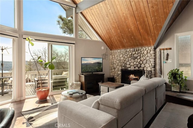 27482 Matterhorn Dr, Lake Arrowhead, CA 92352 - living area with a stone fireplace, high vaulted ceiling, wood ceiling, and wood finished floors