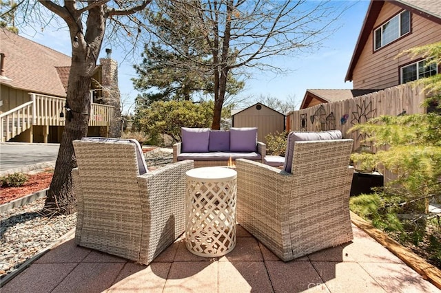 27482 Matterhorn Dr, Lake Arrowhead, CA 92352 - view of patio / terrace featuring a shed and an outdoor living space