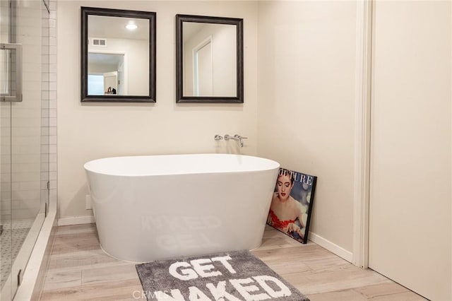 4054 Corte Cima, Thousand Oaks, CA 91360 - full bathroom with wood finished floors, a freestanding bath, and baseboards