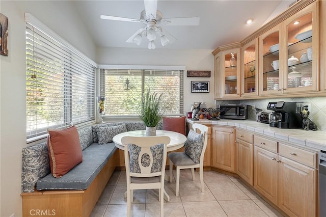 4054 Corte Cima, Thousand Oaks, CA 91360 - dining area featuring light tile patterned flooring, ceiling fan, and vaulted ceiling