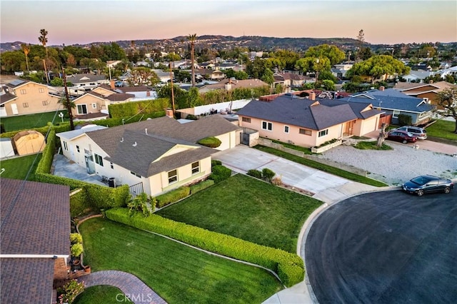 aerial view at dusk with a residential view