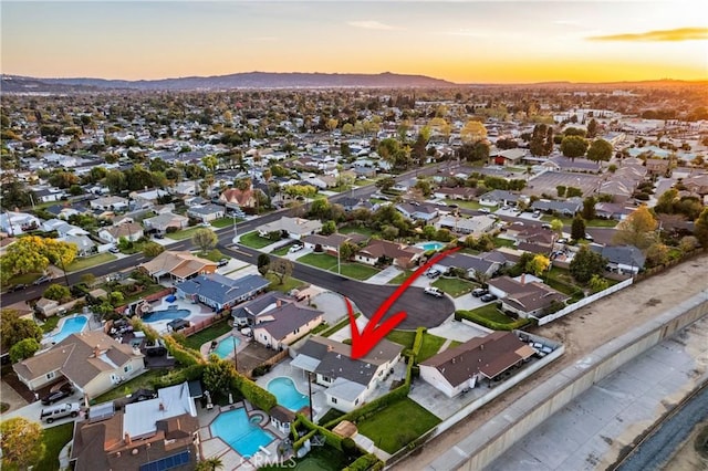 birds eye view of property featuring a mountain view and a residential view