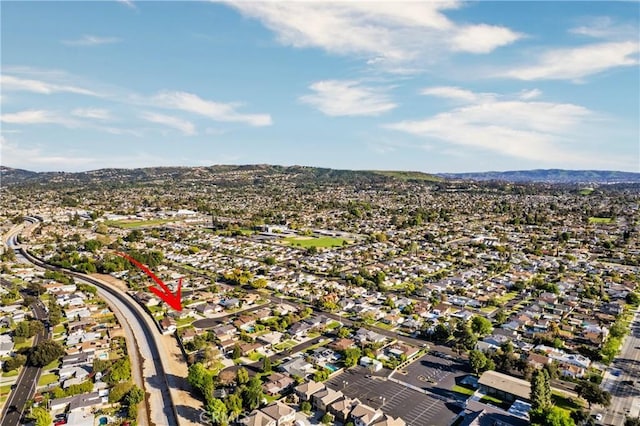 drone / aerial view with a residential view and a mountain view
