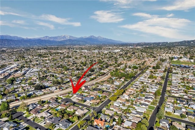 aerial view with a residential view and a mountain view