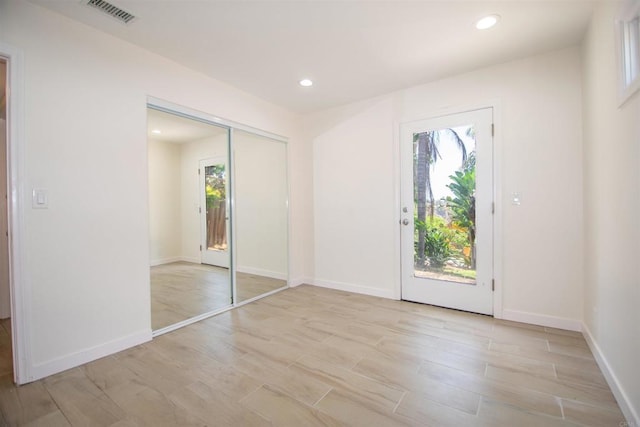 2821 Macdonald St, Oceanside, CA 92054 - unfurnished bedroom featuring access to exterior, light wood finished floors, a closet, and recessed lighting
