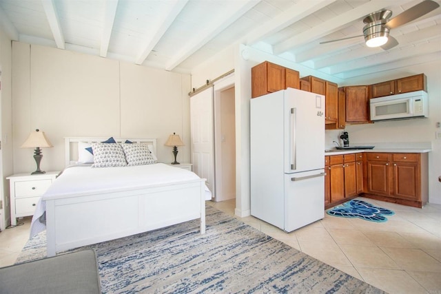 2821 Macdonald St, Oceanside, CA 92054 - bedroom with freestanding refrigerator, beamed ceiling, light tile patterned floors, a barn door, and ceiling fan
