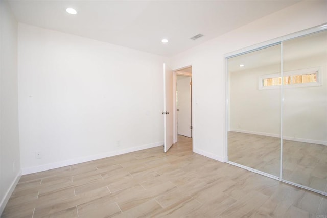 2821 Macdonald St, Oceanside, CA 92054 - unfurnished bedroom with light wood finished floors, recessed lighting, and a closet