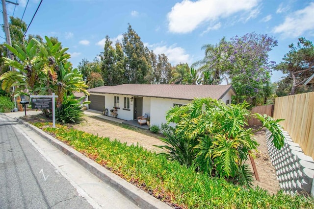 2821 Macdonald St, Oceanside, CA 92054 - view of front facade featuring a garage, stucco siding, and driveway