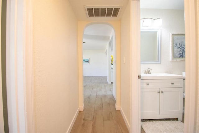 2821 Macdonald St, Oceanside, CA 92054 - hall with light wood finished floors and arched walkways