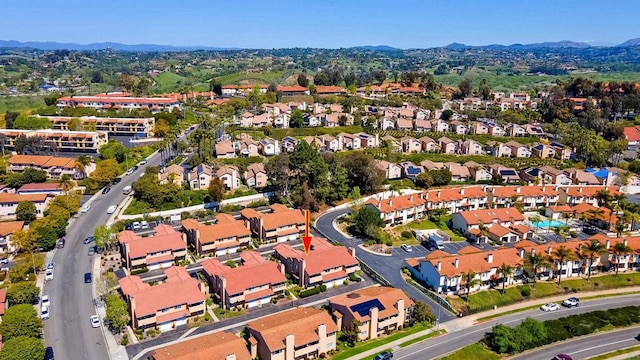 birds eye view of property featuring a mountain view and a residential view