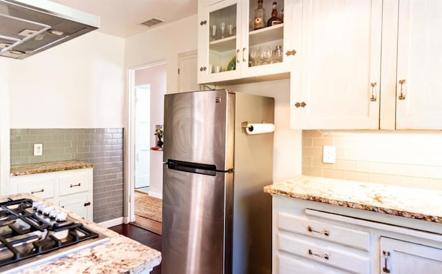 4640 Max Dr, San Diego, CA 92115 - kitchen with stainless steel appliances, dark wood finished floors, glass insert cabinets, white cabinets, and range hood