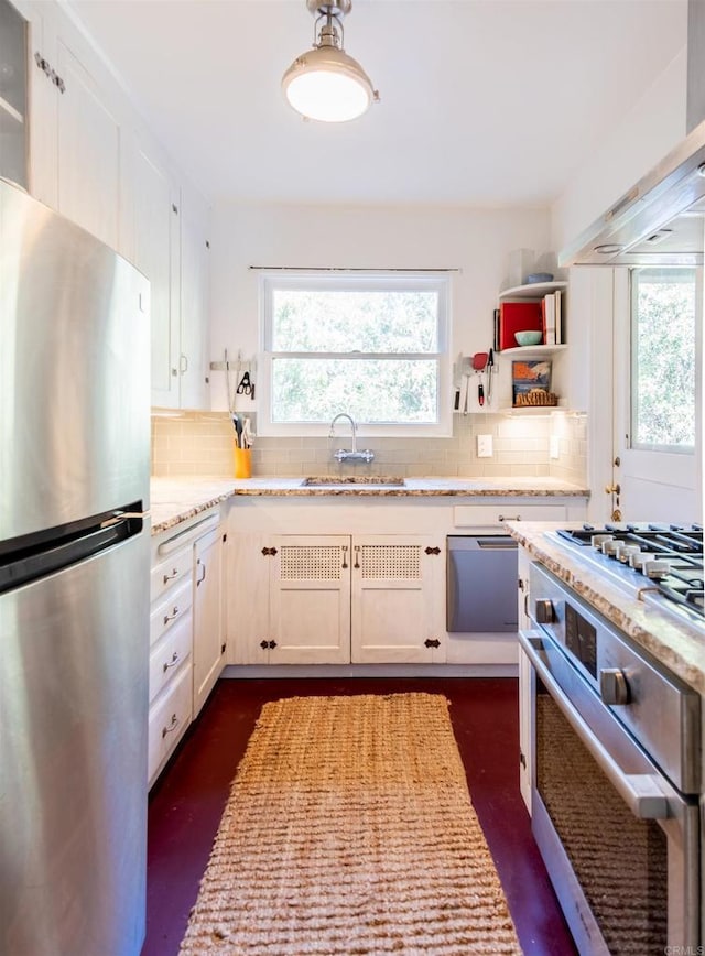 4640 Max Dr, San Diego, CA 92115 - kitchen with appliances with stainless steel finishes, decorative backsplash, light stone counters, and white cabinetry