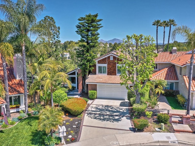 27275 Comba, Mission Viejo, CA 92692 - view of front of property featuring concrete driveway, a garage, a mountain view, and a tile roof