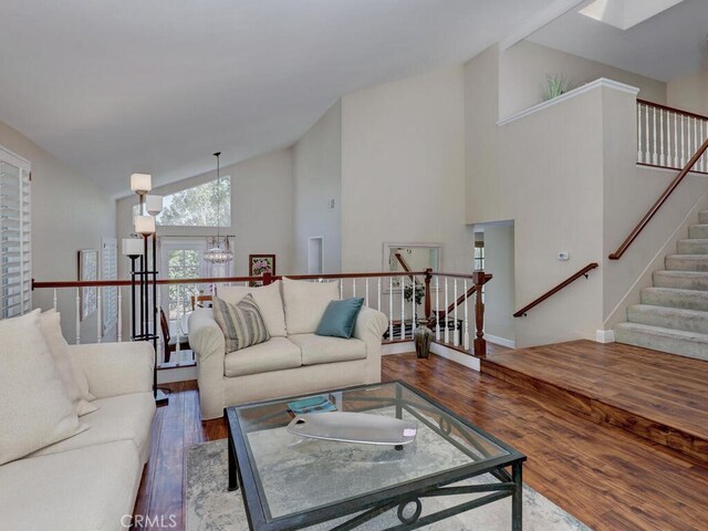 27275 Comba, Mission Viejo, CA 92692 - living room with wood finished floors, a chandelier, high vaulted ceiling, and a skylight