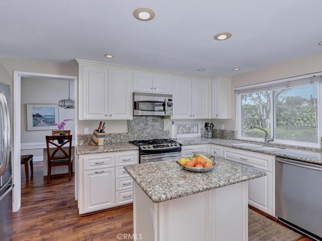 27275 Comba, Mission Viejo, CA 92692 - kitchen with stainless steel appliances, a sink, white cabinetry, dark wood-type flooring, and recessed lighting