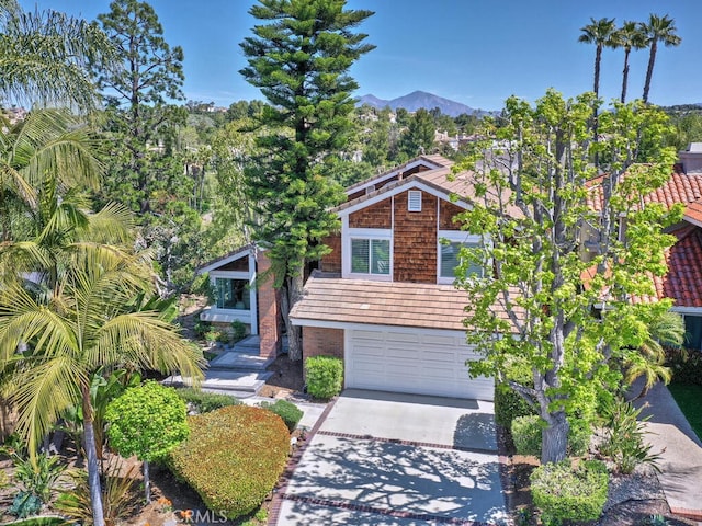 27275 Comba, Mission Viejo, CA 92692 - view of front of property with driveway, brick siding, a garage, and a mountain view