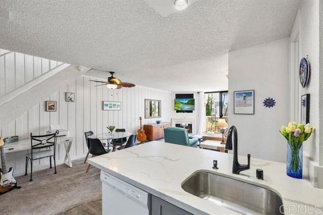 999 N Pacific St Unit G326, Oceanside, CA 92054 - kitchen featuring a sink, white dishwasher, a textured ceiling, a ceiling fan, and open floor plan