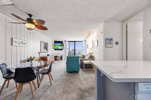 999 N Pacific St Unit G326, Oceanside, CA 92054 - carpeted dining room with a textured ceiling and ceiling fan