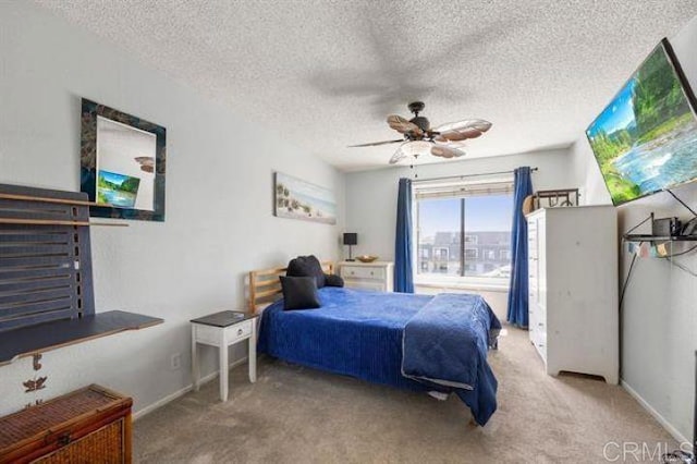 999 N Pacific St Unit G326, Oceanside, CA 92054 - carpeted bedroom featuring a textured ceiling and a ceiling fan