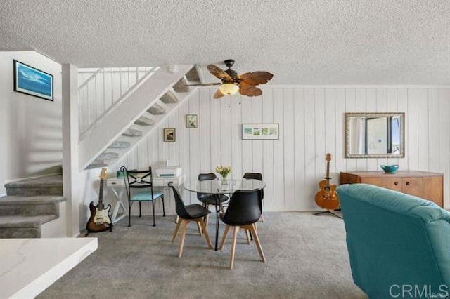 999 N Pacific St Unit G326, Oceanside, CA 92054 - dining room with stairway, a textured ceiling, ceiling fan, and carpet floors